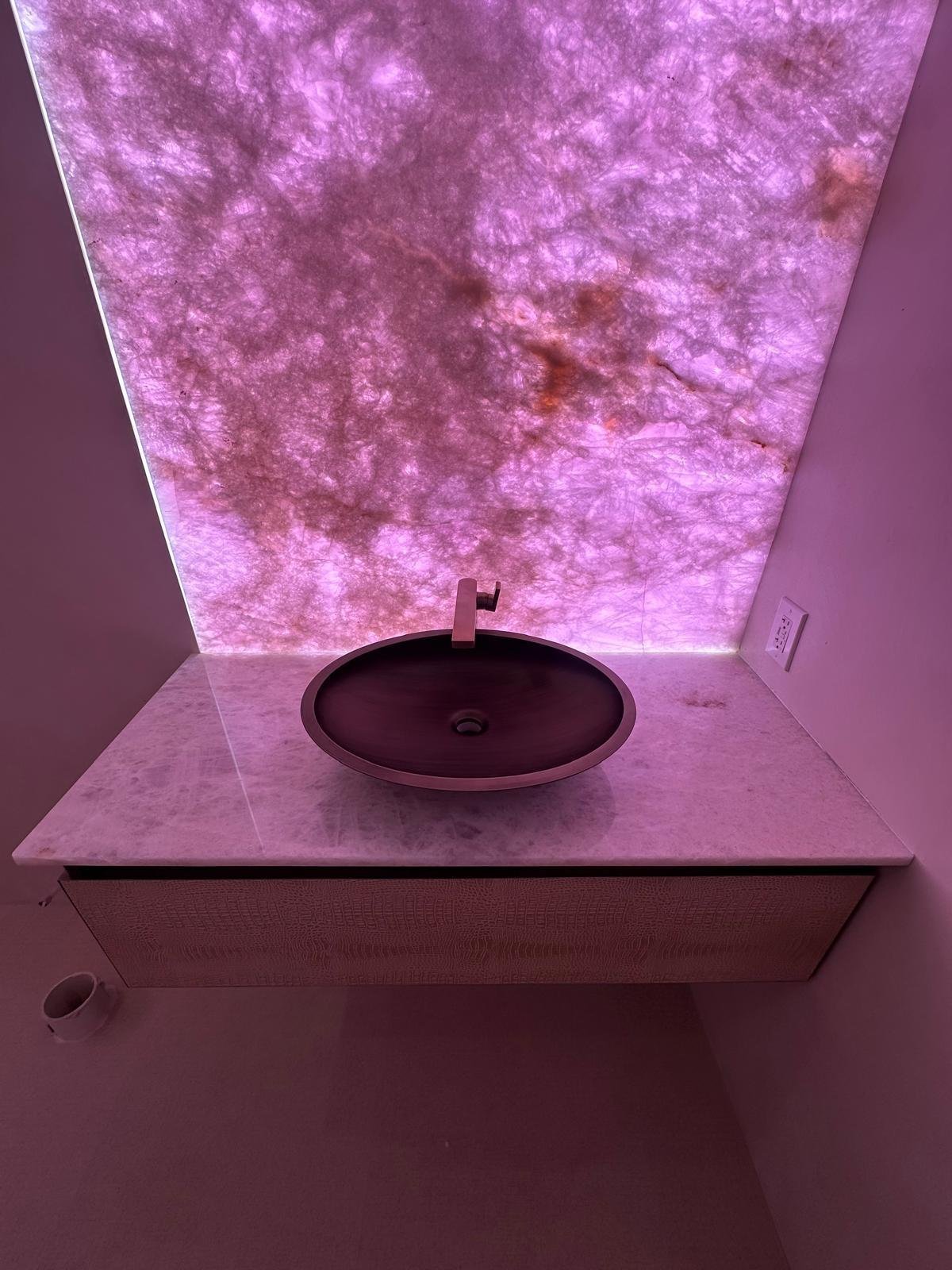 Backlit rose quartz vanity feature