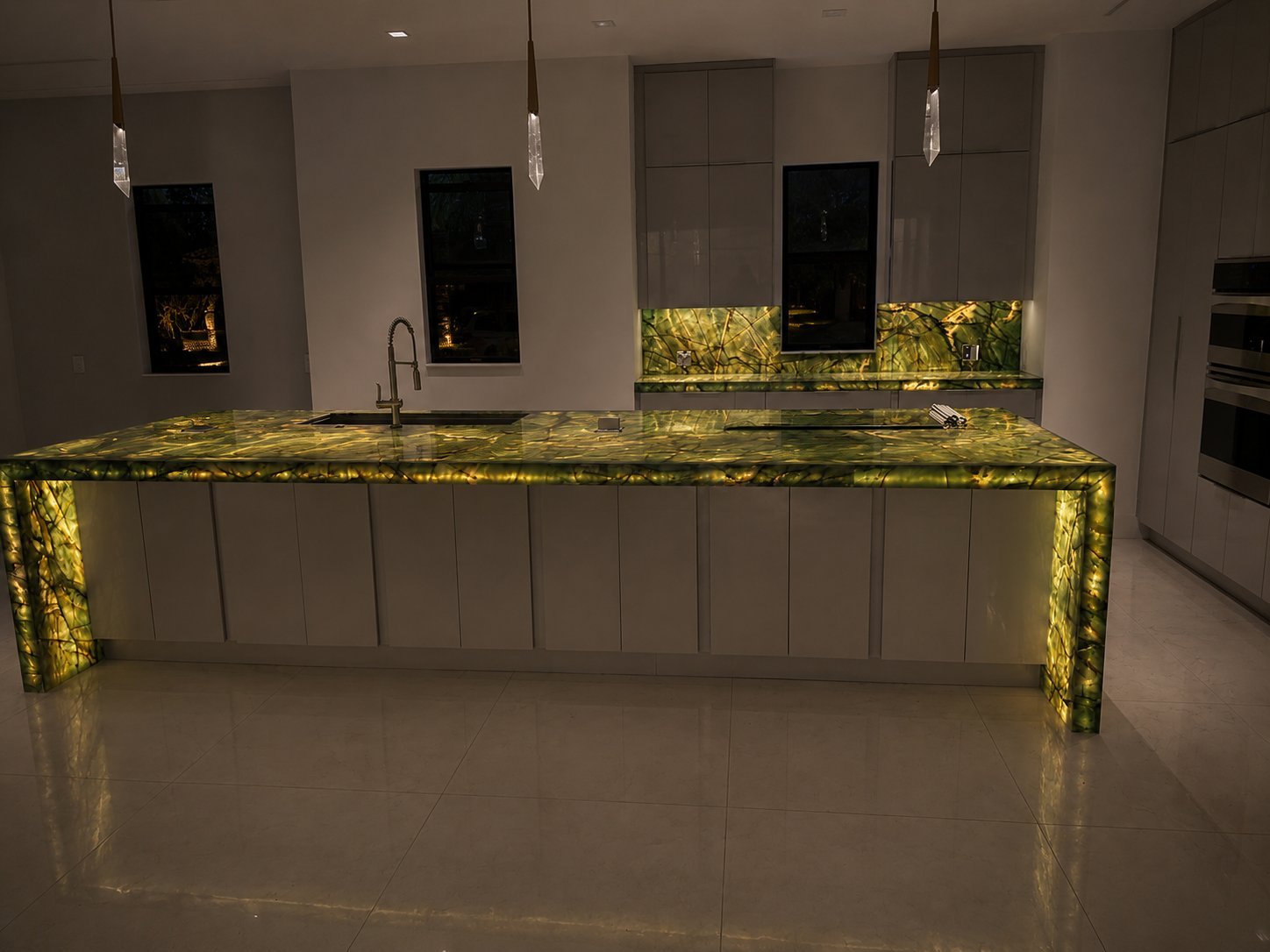 Backlit green quartzite kitchen wide view